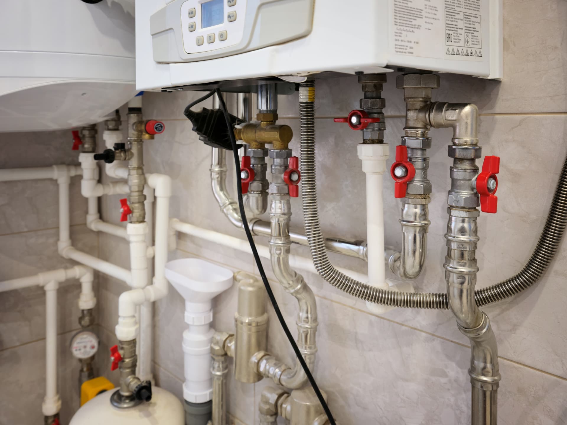 Heat interface unit with connected pipes and isolation valves